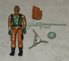 ROADBLOCK (v1) HEAVY MACHINE GUNNER  1984 Complete: Roadblock came with a light green helmet, a brown backpack, a brown ammo box (that attached to the backpack), a light green M-2X machine gun, and a light green tripod.