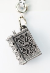 Traveler's Trinkets: Tome Charm